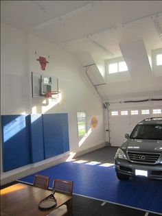 an suv is parked in the middle of a garage