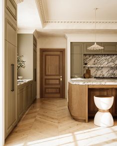 a large kitchen with marble counter tops and wooden cabinets, along with two white stools