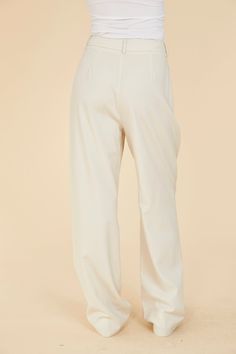 Straddle the line between polished and relaxed with our Pleated Wide Leg Pants. The front pleats lend a formal touch, while the wide leg and loose fit allow for a more relaxed, comfortable style. Available in an elegant cream color, these women’s pleated pants seamlessly transition from refined to casual, offering versatility for various occasions. Elevate your wardrobe with this sophisticated yet laid-back staple. Pleated Wide leg Loose fit Match with Double Pocket Crop Jacket style 75405 Dry c Formal Cream Wide-leg Bottoms, Chic Cream Wide Leg Pants For Formal Occasions, Cream Wide Leg Dress Pants For Formal Occasions, Classic Cream Wide Leg Pants For Work, Cream Wide Leg Dress Pants For Work, Cream Wide-leg Dress Pants For Work, Elegant Cream Straight Leg Bottoms, Elegant Cream Wide-leg Pants, Elegant Cream Ankle-length Bottoms