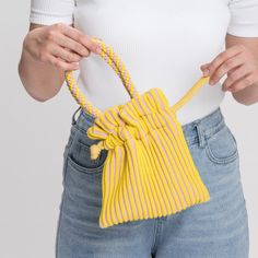 Stripes on stripes on stripes! Fully lined, cheerful knit mini tote with hand-knotted handle. Fits all the essentials in an easy drawstring shape. Details Body: 100% AcrylicLining: 100% Cotton Hand wash cold, dry flat9.5"W, 9.5"L, 3.75" strap drop Mini Pouches, Candy Stripes, Ux Web Design, Mini Tote, Web Development Design, Pouch Bag, Design Development, Diy Sewing, Bucket Bag