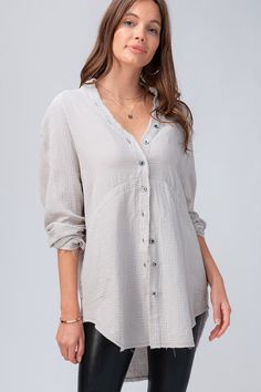 Waverly Button Up Tunic is an effortless chic style featuring side pockets and frayed edges. Cut with a relaxed fit, long sleeves and a button down front, this crinkly cotton fabric is lightweight and casual.  100% Cotton Fall Cotton Tops With Crinkle Texture, Daywear Long Sleeve Tops With Crinkle Texture, Long Sleeve Tops With Crinkle Texture For Daywear, Fall Cotton Blouse With Crinkle Texture, Casual Long Sleeve Blouse With Frayed Hem, Long Sleeve Cotton Blouse With Crinkle Texture, Cotton Long Sleeve Blouse With Crinkle Texture, Fall Long Sleeve Blouse With Frayed Hem, Long Sleeve Blouse With Frayed Hem For Fall