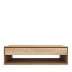 a wooden coffee table sitting on top of a white wall