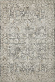 an area rug with grey and white colors