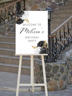 a welcome sign stands in front of steps and railings, with the words welcome to nelson's birthday party written on it