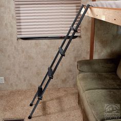 a ladder leaning up against the wall near a couch