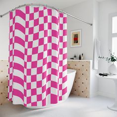 a pink and white checkered shower curtain in a bathroom