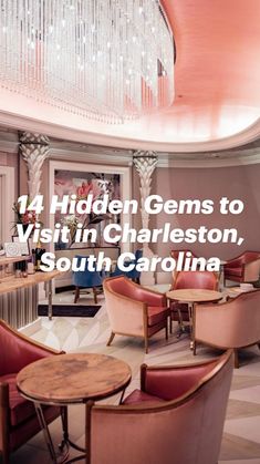 an elegant restaurant with pink chairs and chandelier