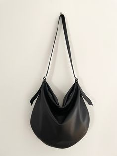 Leather Hobo bag, Black Leather Bag. Soft Leather Purse, elegant and refined, with a comfortable shape and with sinuous lines. The particular shape of this Leather Hobo Purse will give a beautiful accent to your outfit, and the modern style will be current year after year. Genuine Leather Bag for the evening or for a wedding event but also for everyday. Leather bag Women made of black genuine Italian leather, high quality and soft at the touch, very light. Black Leather Purse has the adjustable Leather Bags Women, Soft Leather Purse, Leather Bag Design, Italian Leather Bags, Black Leather Bag, Hobo Purse, Black Leather Purse, Leather Bag Women, Black Leather Handbags