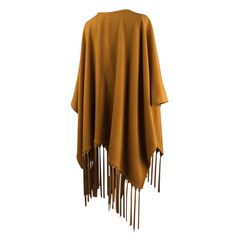 Guaranteed authentic rare Hermes unique vintage shawl/poncho with a dramatic leather fringe. Striking warm gold cashmere and wool large poncho styled shawl. Rich with long, lush leather fringes. The leather is supple, soft and fabulous in the matching color to the cashmere.Two pockets. Utterly amazing piece to live in. Fabric is cashmere and wool.Listing is for the shawl only - Belt not included.LIKE NEWBuy vintage Hermes online at mightychic for superior service and a seamless shopping experien Fall Fringe Cape Outerwear, Fringe Cape Outerwear For Fall, Winter Fringe Cape Shawl, Fringe Shawl Outerwear For Fall, Fall Shawl Cape With Fringe, Fringe Shawl Cape For Fall, Bohemian Tassel Cape For Fall, Bohemian Cape With Tassels For Fall, Fall Fringe Cape Poncho