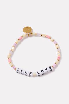 A wearable reminder of words to live by, this beaded bracelet by Little Words Project is handcrafted with “Self Love” lettering, multicolor beads, and stretch elastic for easy on-and-off. Alone or stacked, it makes the perfect gift for yourself or a friend. Little Words Project encourages you to wear your word to lift you up, and then pass it on to someone who needs it more. Each bracelet comes with a unique ID tag. Use this code to register your bracelet on the Little Words Project website to j Project Website, Little Words Project, Your Word, Love Bracelet, Shoe Size Conversion, Pink Bracelet, Love Bracelets, Id Tag, Acrylic Beads