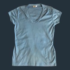 "65% Cotton 35% Polyester Made in China MEASUREMENTS: Armpit to Armpit 16.5\" Top Shoulder to Bottom Hem 24.5\" Sleeves 4\" Shoulder to Shoulder 14.5\" Smoke-free but pet-friendly household." Blue Stretch V-neck T-shirt, Casual Light Blue V-neck T-shirt, Fitted Blue T-shirt With Scoop Neck, Blue Relaxed Fit Scoop Neck T-shirt, Light Blue Fitted V-neck T-shirt, Blue Cotton T-shirt With Scoop Neck, Basic Blue V-neck T-shirt, Casual Blue Scoop Neck T-shirt, Light Blue Cotton V-neck T-shirt