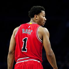 a close up of a basketball player wearing a red uniform