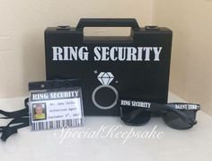 a bag, sunglasses and id card sitting on top of a white table next to a pair of glasses