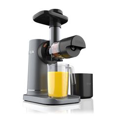 an image of a juicer with orange juice in it