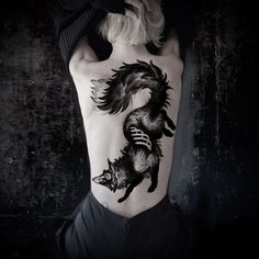 a woman with a tattoo on her back