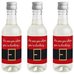 three empty bottles with red and black labels on them that say, he sees you when you're drinking