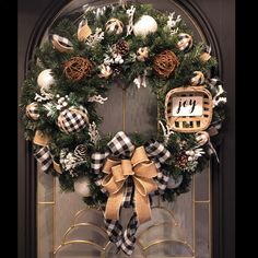 a christmas wreath hanging on the front door