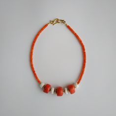 < Orange and white coral beaded necklace > This product made according to the model of authentic traditional Ukrainian jewelry. The coral is modern, the design is vintage. Like 99% of the coral on the market these days, this coral has been dyed. I use bamboo coral which is not endangered or threatened in any way, unlike natural pink or red coral (the production of which is forbidden almost everywhere in the world). Bamboo coral doesn't mean it's not organic. Every bead of it has a distinct Orange Red Coral Beads For Jewelry Making, Orange Red Coral Beaded Necklaces Hand-strung, Orange Red Coral Gemstone Beaded Necklaces, Orange Red Coral Gemstone Beaded Necklace, Artisan Coral Beaded Necklace Handmade, Handmade Artisan Coral Beaded Necklaces, Polished Coral Beaded Necklaces, Artisan Handmade Coral Beaded Necklace, Coral Red Beaded Necklaces With Polished Beads