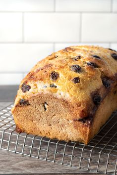 a loaf of bread sitting on top of a cooling rack