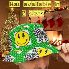 Introducing our vibrant Checkered Bucket Hat, the ultimate Smiley Face Festival Hat that doubles as a Rave Y2K Fashion Accessory and Music Lover Gift. This Lightning Bolt Streetwear Hat combines Retro 90s style with modern flair, making it the perfect Outdoor Concert Hat for fashion-forward individuals seeking a statement piece. STAND OUT IN STYLE WITH OUR VERSATILE CHECKERED BUCKET HAT  * Eye-catching design featuring a green checkered pattern, yellow smiley faces with lightning bolt eyes, and Concert Hat, Checkered Bucket Hat, Rave Y2k, Streetwear Hats, Yellow Smiley Face, Retro Looks, Festival Hat, Streetwear Mode, Outdoor Concert