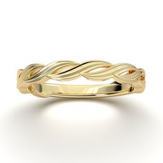 a yellow gold wedding band with two twisted leaves on the top and bottom, set against a white background