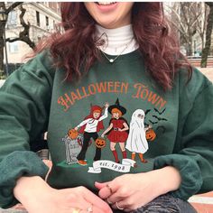 It's beginning to feel like spooky season, and this vintage 90s inspired Halloween Town sweatshirt is adorable and just the crewneck you need for fall! This vintage style sweatshirt is a great retro option to add to any basic outfit, and also brings on the nostalgia! FAST PRODUCTION AND TURN AROUND TIME WITH A STAR SELLER RATED STORE 💖⭐ SIZING Relaxed fit - size up for a more baggy fit! RETURN POLICY Please check our shop policies FAQ for more info!  About SUGAR FACE GOODS   💖 Woman designed, owned & operated  ⛅ Lightweight packaging  🌟 5-star rated store  📦 1-2 day production time & fast shipping  🫶 Every review given to our store is returned in love with a special discount   💌 Got an idea we don't make yet? Please send me a message Retro Halloween Cats Crewneck, Vintage Halloween S Retro Long Sleeve Halloween Tops, Vintage Halloween Sweatshirt For Streetwear, 90s Graphic Print Fall Sweatshirt, Fall Horror Crew Neck Sweatshirt, Vintage Halloween Long Sleeve Sweatshirt, Horror Crew Neck Sweatshirt For Fall, Vintage Long Sleeve Halloween Sweatshirt, Horror Style Crew Neck Sweatshirt For Fall, Vintage Crew Neck Halloween Tops