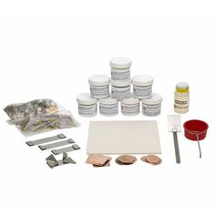 an assortment of paint and tools for painting