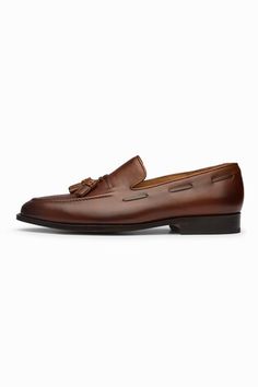 Brown leather loafers with tassel ornamentation. - Aza Fashions Formal Brown Dress Shoes With Tassels, Brown Tassel Moccasins For Formal Occasions, Formal Brown Tasseled Moccasins, Elegant Brown Loafers With Tassels, Classic Tassel Slip-on Loafers, Formal Wingtip Leather Shoes With Tassels, Classic Slip-on Moccasins With Tassels, Business Tassel Loafers With Plain Toe, Classic Leather Business Shoes With Tassels