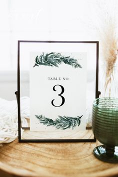 a table number is placed on top of a wooden table