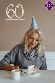 an older woman sitting at a table with a piece of cake in front of her