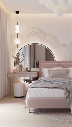 a bed sitting under a round mirror next to a table with a lamp on it