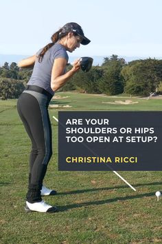 a woman holding a golf ball in her right hand with the caption are your shoulders or hips too open at setup?