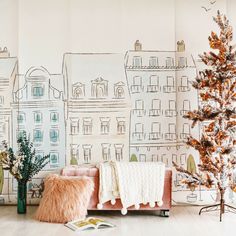 a living room with a christmas tree in the corner and wallpaper on the walls