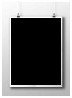 a black square poster hanging on a white wall with two metal clips attached to it