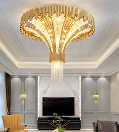 an elegant living room with chandelier and couches