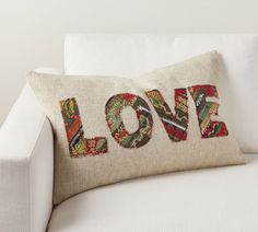 a love pillow on a white couch