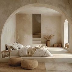 a bedroom with an arch leading into another room