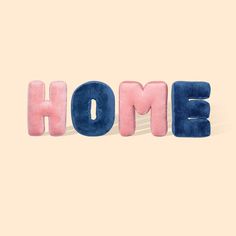 the word home spelled with pink and blue letters