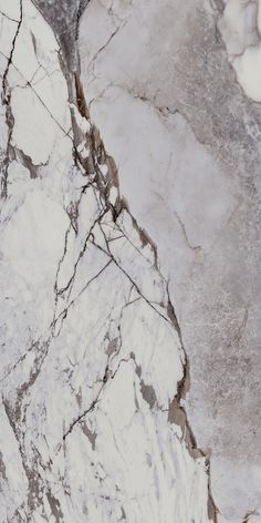 an aerial view of the surface of a marbled area with ice and snow on it