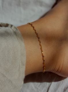 You'll love the delicate shine of this anklet! A simple sparkly chain dipped in 18k gold over stainless steel shape this simply stunning ankle bracelet. Ideal for stacking with other anklets or wear it by itself. MATERIALS & SIZE Material: 18k stainless steel Size: 8, 8.5, 9 or 9.5 in. chain + 1 in. extender Closure: Toggle clasp JEWELRY CARE Most of our jewelry is tarnish resistant, hypoallergenic, safe for sensitive skin. Handmade with ♡ in New York. - To maintain the beauty of your jewelry, w Anklet Stack, Gold Chain Anklet, Functional Jewelry, Gold Anklet, Ankle Chain, Ankle Bracelet, Chain Anklet, Trendy Jewelry, Ankle Bracelets