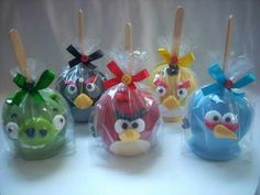 six angry birds in plastic bags with toothpicks sticking out of them'heads