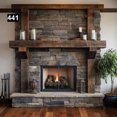 a fireplace with some candles on it and a potted plant in front of it