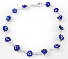 These beautiful sterling silver evil eye bracelets are functional for keeping harmful gazes at bay. Wear for fortune and good luck.  925 Sterling silver, with 14  round beads, they're  5mm each.  Bracelet is 19cm in length, choose from dark blue or light blue translucent glass. What is the Evil Eye? The origins of the glass evil eye can be traced back thousands of years to ancient Mesopotamia, according to folklore, the Evil Eye is believed to bring misfortune when someone casts an envious gaze Handmade Sterling Silver Evil Eye Bracelet, Handmade Silver Evil Eye Bracelet, Sterling Silver Evil Eye Bracelet As Gift, Sterling Silver Spiritual Evil Eye Bracelet Gift, Spiritual Sterling Silver Evil Eye Bracelet Gift, Spiritual Sterling Silver Evil Eye Bracelet, Handmade Sterling Silver Blue Evil Eye Bracelet, Handmade Blue Evil Eye Bracelet In Sterling Silver, Handmade Blue Sterling Silver Evil Eye Bracelet