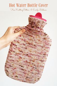 a hand holding a knitted water bottle cover in front of a white background with the words hot water bottle cover written below it