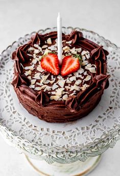 a cake with chocolate frosting and strawberries on top