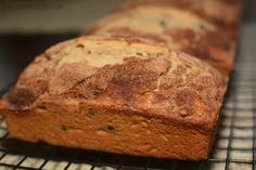 a loaf of bread sitting on top of a cooling rack