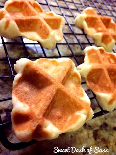 four waffles are cooling on a wire rack