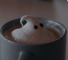 there is a cup that has some kind of ghost in it