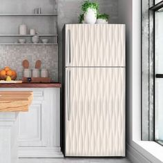 a white refrigerator freezer sitting inside of a kitchen