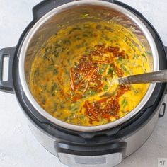 an overhead view of a pot filled with food